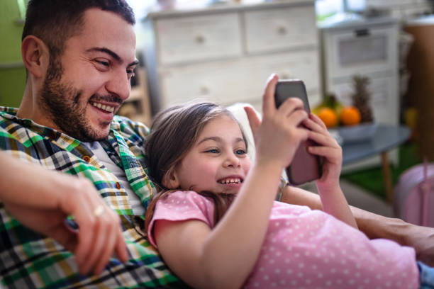 istock Family at home using smart phone 1133173410