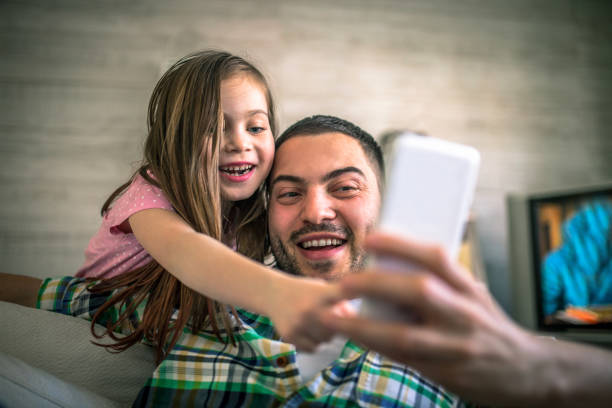 istock Family at home using smart phone 1133173758