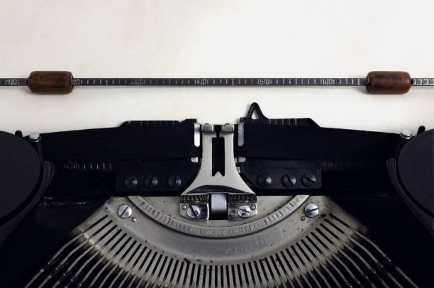 istock Old retro vintage black typewriter with close-up and copy space on aged paper 1133174985