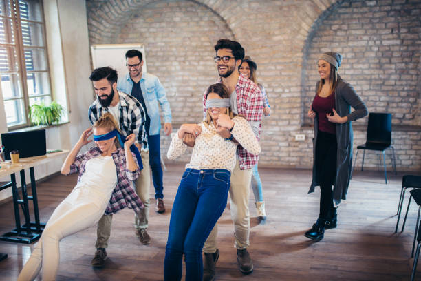 istock Business people making team training exercise during team building seminar, play a game of trust 1133176105