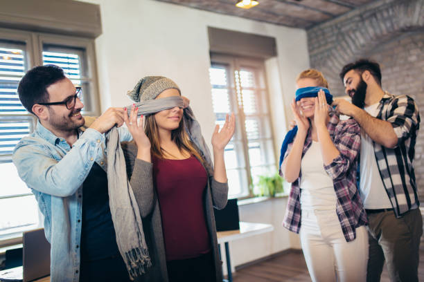 istock Business people making team training exercise during team building seminar, play a game of trust 1133176157