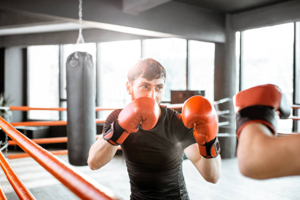 istock Two professional boxers fighting at the gym 1133176252