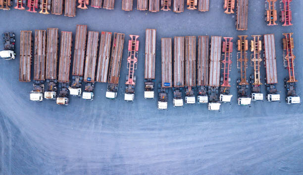 istock Top view of trucks and trailers 1133176292