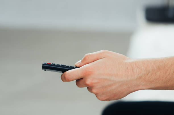istock the TV remote in hand 1133177505
