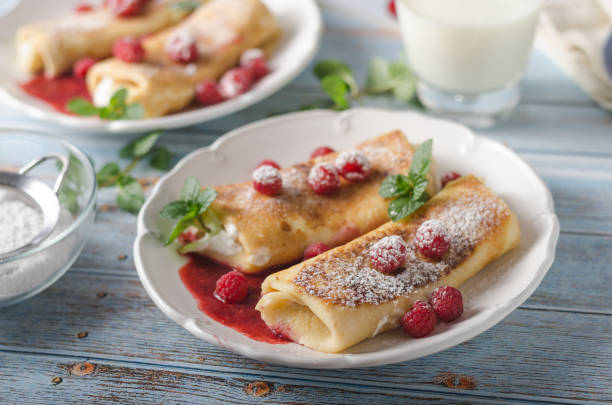 istock Cheese blintzes pancakes with fresh fruit 1133178132