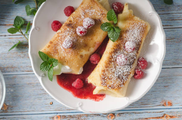 istock Cheese blintzes pancakes with fresh fruit 1133178924