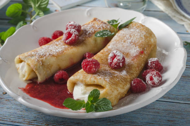 istock Cheese blintzes pancakes with fresh fruit 1133179135