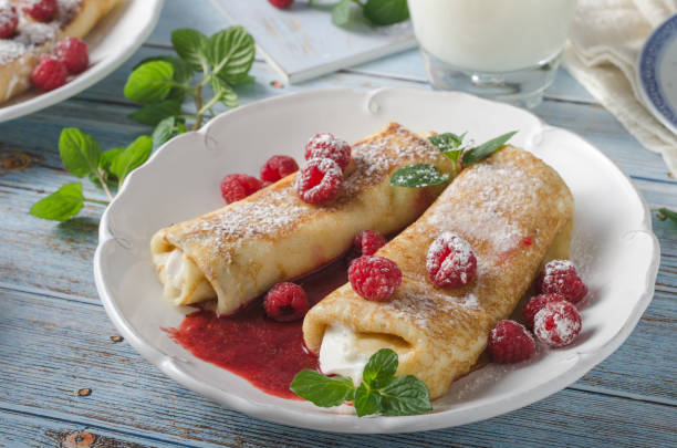 istock Cheese blintzes pancakes with fresh fruit 1133179448