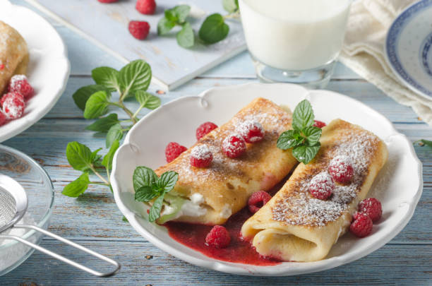 istock Cheese blintzes pancakes with fresh fruit 1133179603