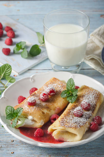 istock Cheese blintzes pancakes with fresh fruit 1133180513