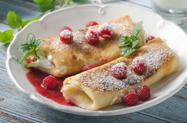 istock Cheese blintzes pancakes with fresh fruit 1133181090