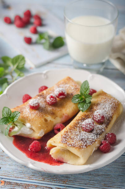 istock Cheese blintzes pancakes with fresh fruit 1133182106