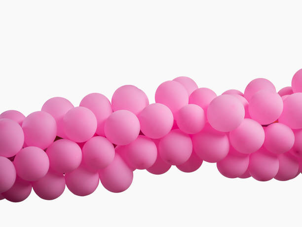 istock Pink color decorated balloons in a row over white background , with clipping path 1133183546