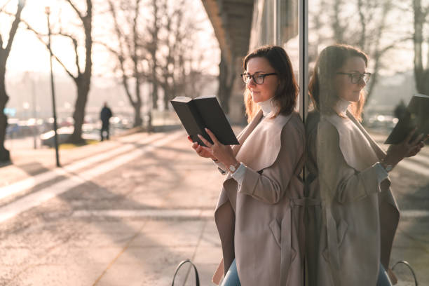 istock Female student is reading a book on campus 1133183692