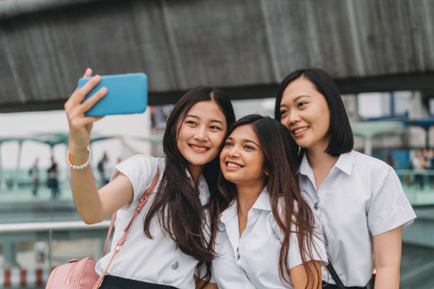istock Three student friends taking a selfie together in the city 1133184035