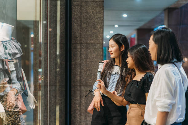 istock Three friends doing shopping together in the city 1133184155