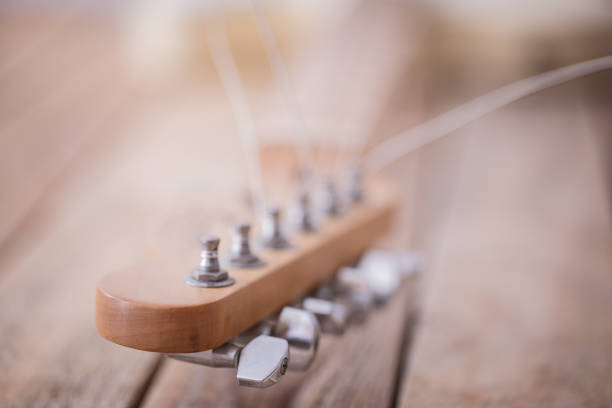 istock Electric guitar neck with string tuners 1133190110