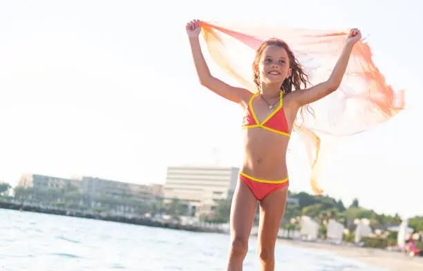 Photo of Beautiful girl running at the beach