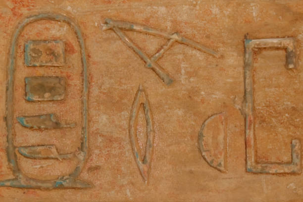 istock Ancient egyptian hieroglyphs carved on the stone wall 1133194627