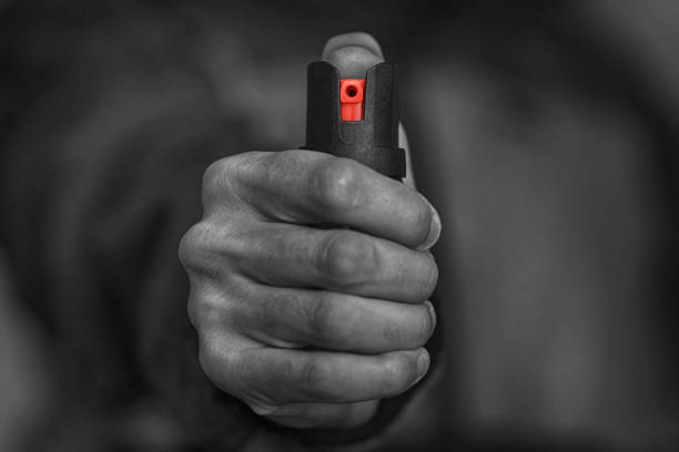 istock Man holding pepper spray in his hand 1133198033