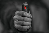 Man holding pepper spray in his hand