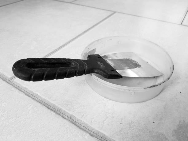 istock Repair - metal trowel and rubber trowel for grouting 1133198329