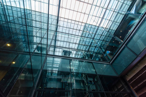 istock Modern glass elevator and pedestrian stairway entrances. 1133199941