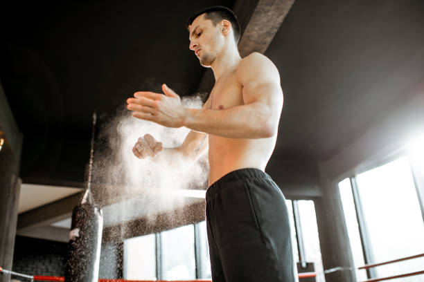 istock Athletic man clapping hands with talcum powder 1133199956