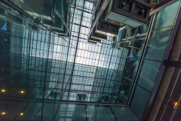 istock Modern glass elevator and pedestrian stairway entrances. 1133201036