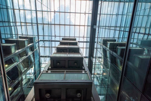 istock Modern glass elevator and pedestrian stairway entrances. 1133202492