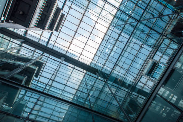 istock Modern glass elevator and pedestrian stairway entrances. 1133202493