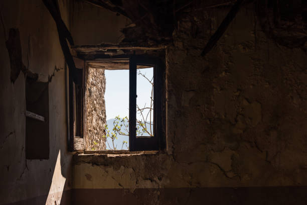 istock Looking out a Window in an Abandoned Ruin in Southern Italy 1133204178
