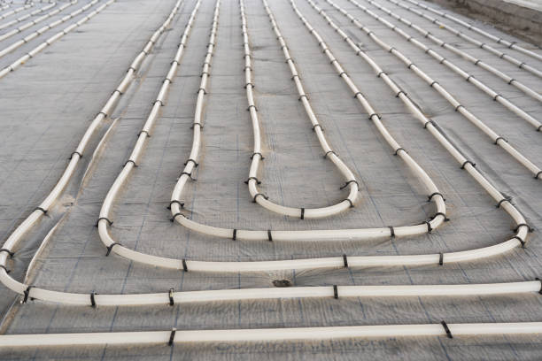 istock Underfloor heating system installation. Close up on water floor heating system interior of a new indoor swimming pool and SPA center. Plumbing pipes. Individual Heating. 1133204214