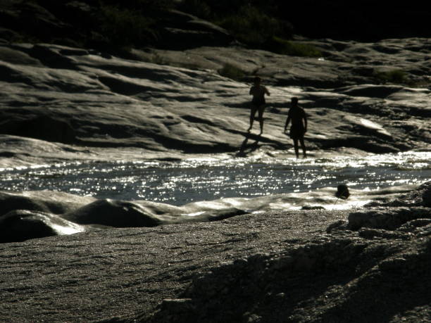 Mina Clavero river landscape with kids in the back