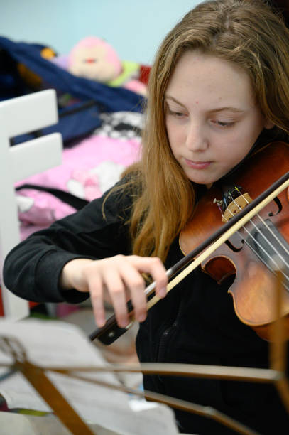 istock Girl playing violin 1133204373