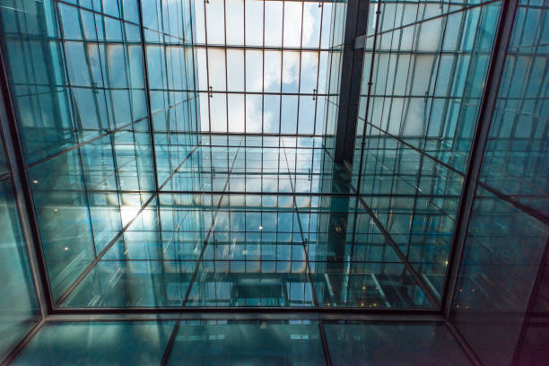 istock Modern glass elevator and pedestrian stairway entrances. 1133204391