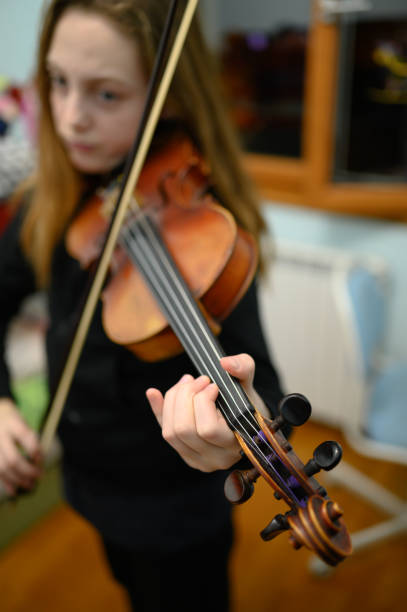 istock Girl playing violin 1133205484