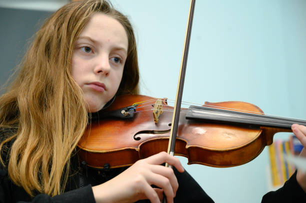 istock Girl playing violin 1133205791