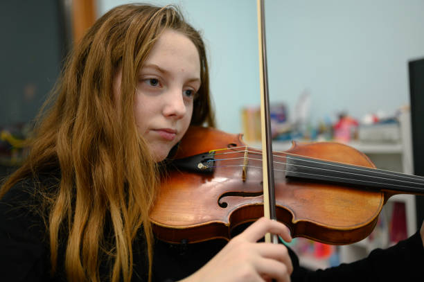 istock Girl playing violin 1133205931
