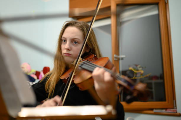 istock Girl playing violin 1133206057