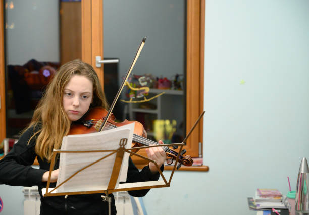 istock Girl playing violin 1133206289