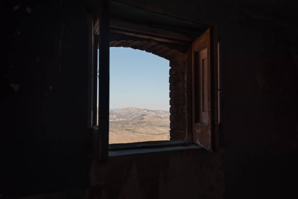 istock Looking out a Window in an Abandoned Ruin in Southern Italy 1133207751