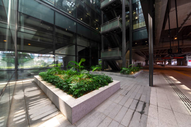 istock Modern glass elevator and pedestrian stairway entrances. 1133208292