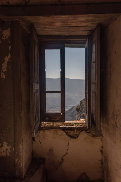 istock Looking out a Window in an Abandoned Ruin in Southern Italy 1133209231