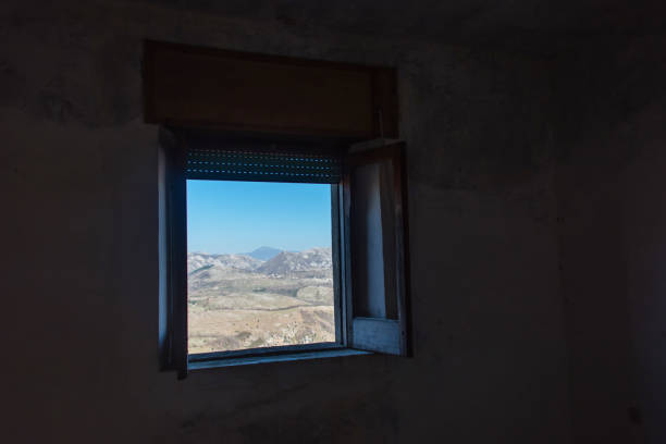 istock Looking out a Window in an Abandoned Ruin in Southern Italy 1133209287