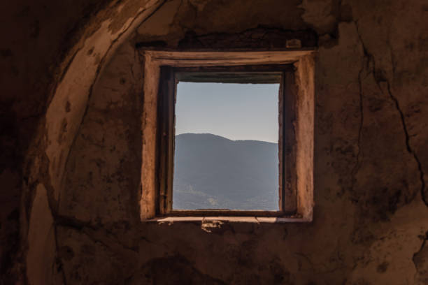 istock Looking out a Window in an Abandoned Ruin in Southern Italy 1133209367