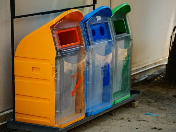 istock Yellow, green, blue recycle bins with recycle symbol 1133210782