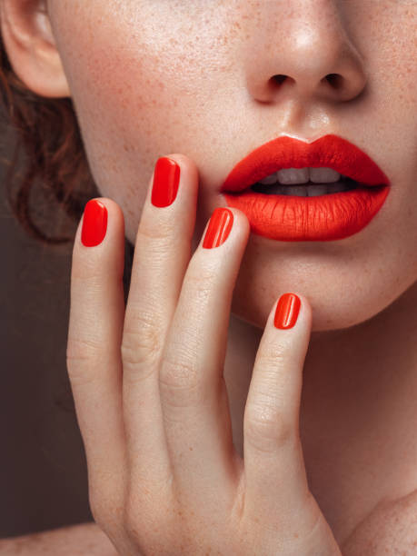 woman's red lips and manicure close-up - cosmetics nail polish beauty spa lipstick imagens e fotografias de stock