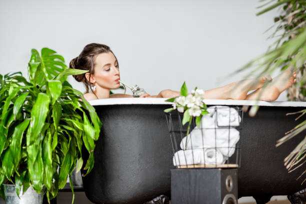 istock Young woman relaxing in the bathtub 1133211977