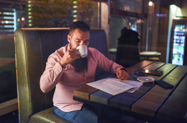 istock A businessman drinks coffee in a restaurant 1133212968